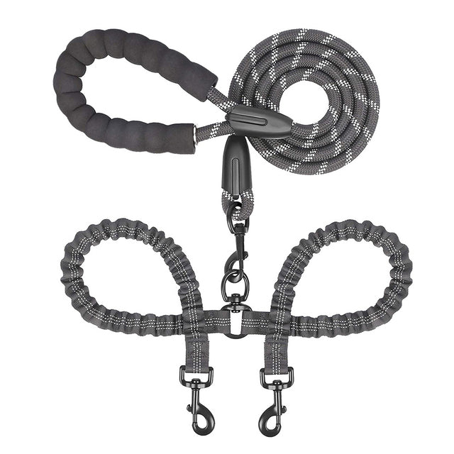 Double dog leash coupler by Zuka & Co. connecting two leashes for walking two dogs together.