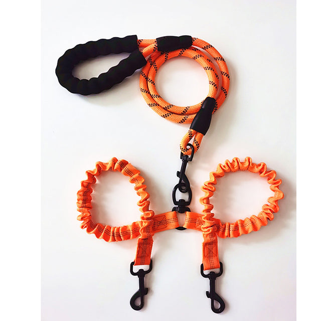 Double dog leash coupler by Zuka & Co. connecting two dogs for a comfortable and convenient walk.
