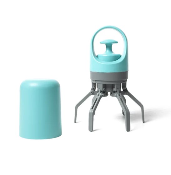 Zuka & Co. dog pooper scooper with a sturdy handle and scoop for easy waste removal in grass or dirt.