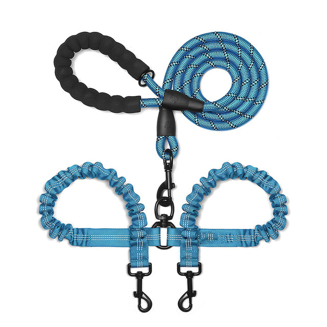 Double dog leash coupler by Zuka & Co. connecting two dogs for easy walking, featuring durable clips and adjustable design.